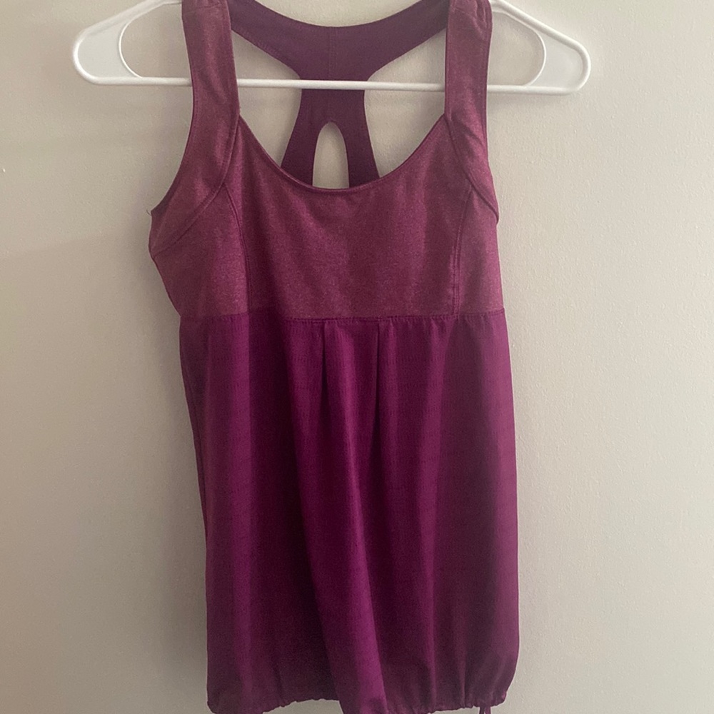 Purple sports tank top with a build on bra
